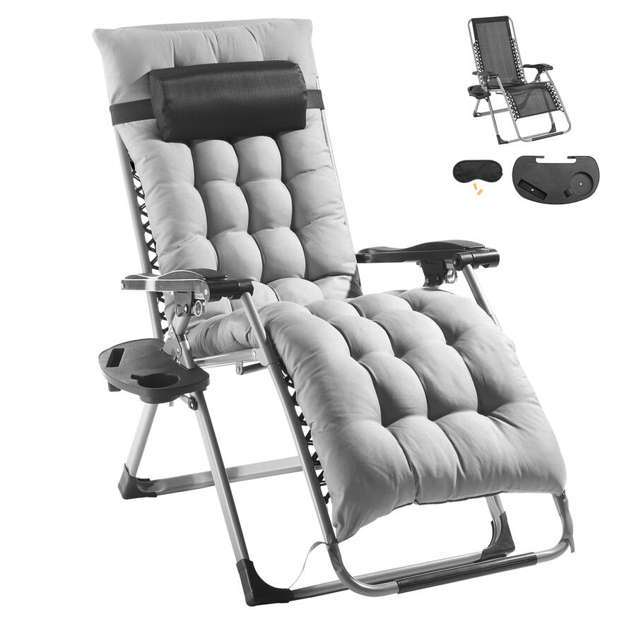 A premium zero gravity reclining lounge chair featuring a thick grey padded cushion, a black headrest, and a side cup holder tray. The image also shows bonus accessories including a sleep mask, earplugs, and a phone holder.